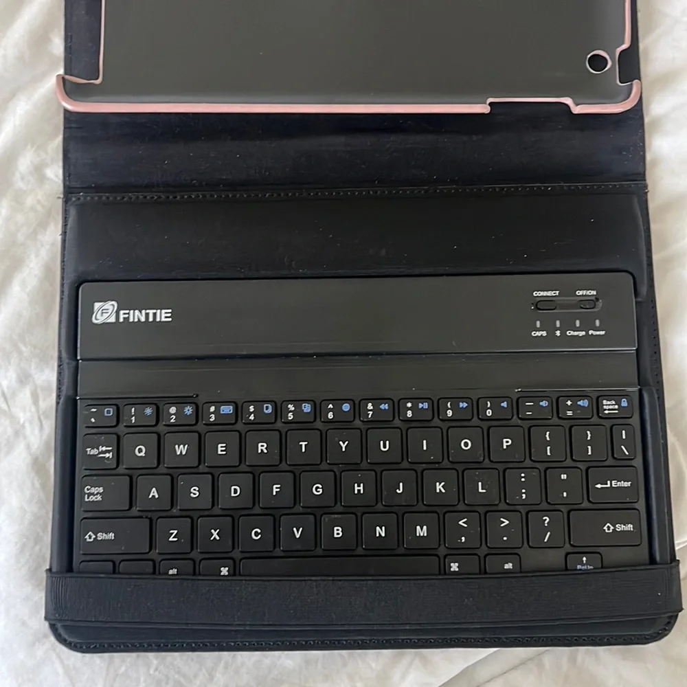Rose gold iPad case with keyboard.